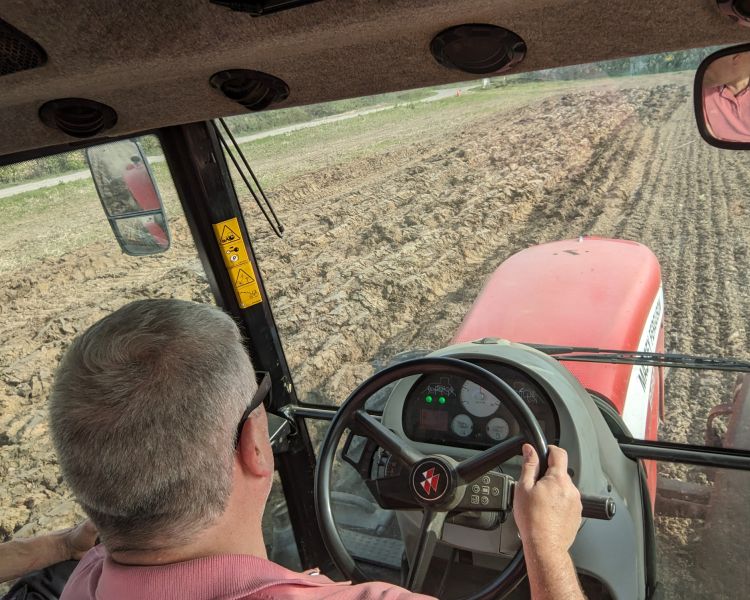 man sitting in tractor on tractor driving experience