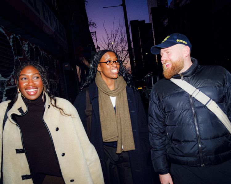 Three friends out in evening on a food treasure hunt in manchester