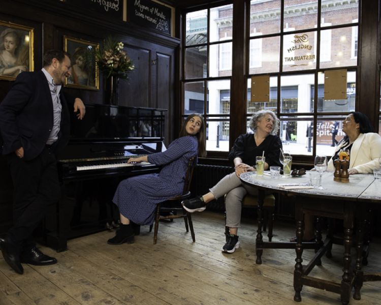 people chatting in a bar in the east end in london