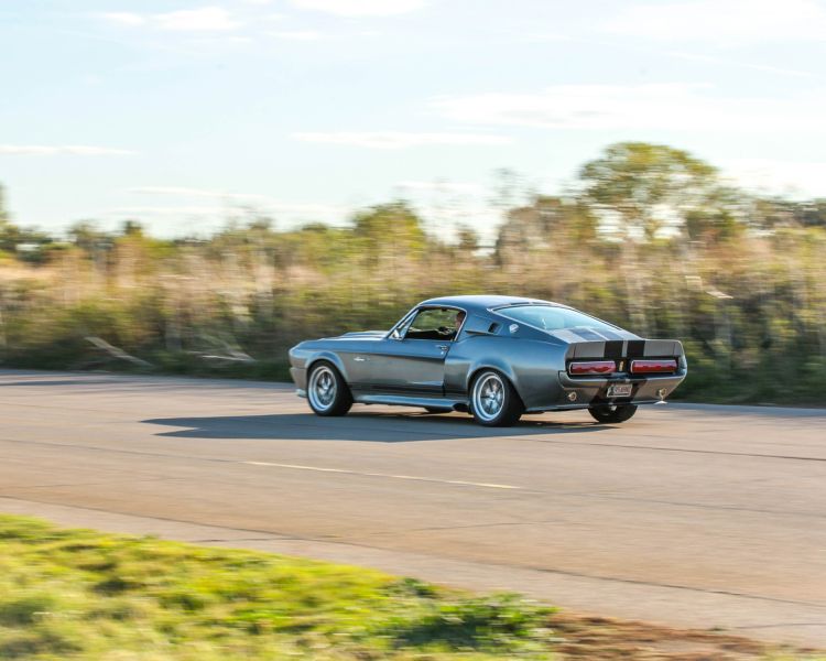 a classic car on a race track as part of a driving experience day