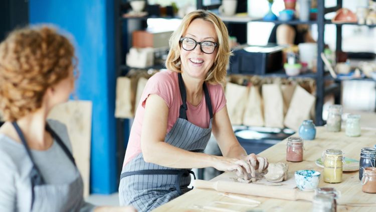 woman enjoying a pottery experience day