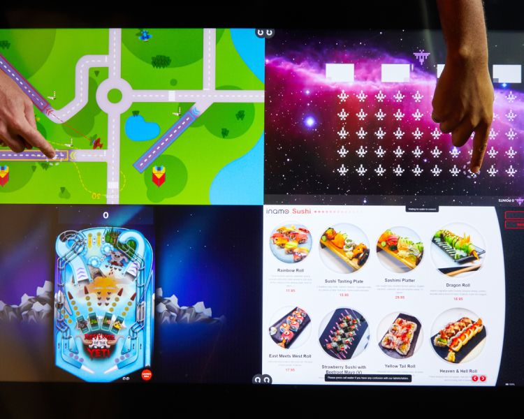 interactive table at inamo london divided into 4 sections for ordering and games