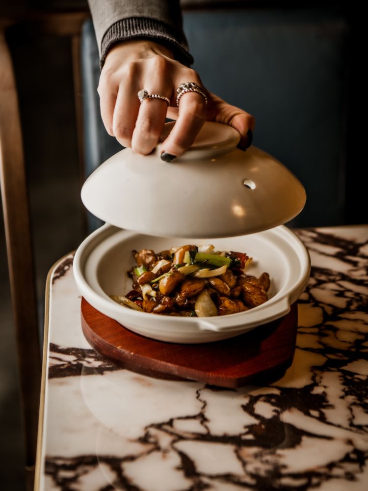 dish being presented on table at gouqi in london