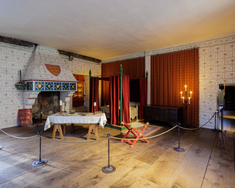 a room inside the tower of london showing what a bedroom would have looked like