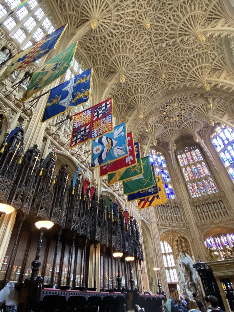 looking up at the decorated ceiling inside westminster abbey in london