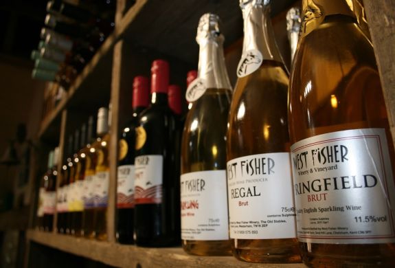 bottles of wine on shelf for a wine tasting experience in kent