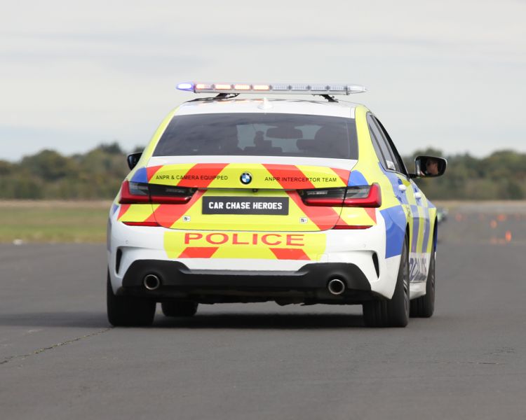 the back of a uk police car taking part in a police car driving experience