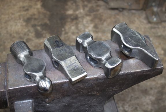 examples of hammer heads made on a hammer making blacksmith experience