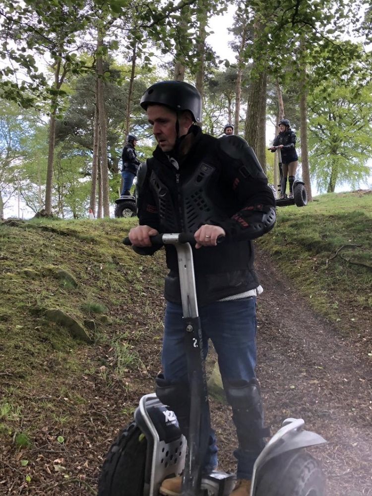 person on segway experience in woodland