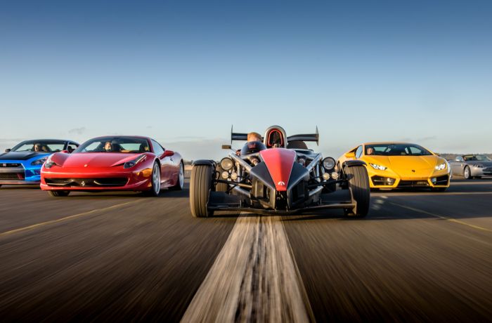 a selection of supercars on a race track at car chase heroes driving experience day