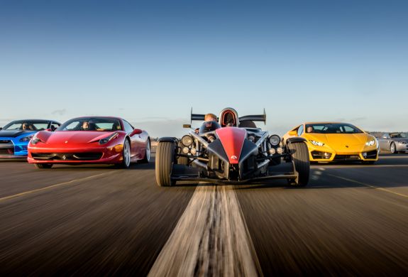 a selection of supercars on a race track at car chase heroes driving experience day