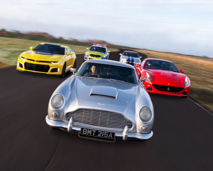 five cars on a race track for an all star track day driving experience