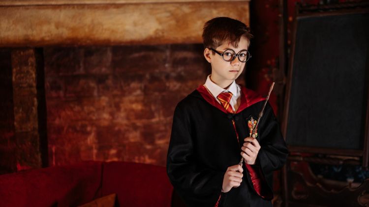 Young boy dressed as harry potter