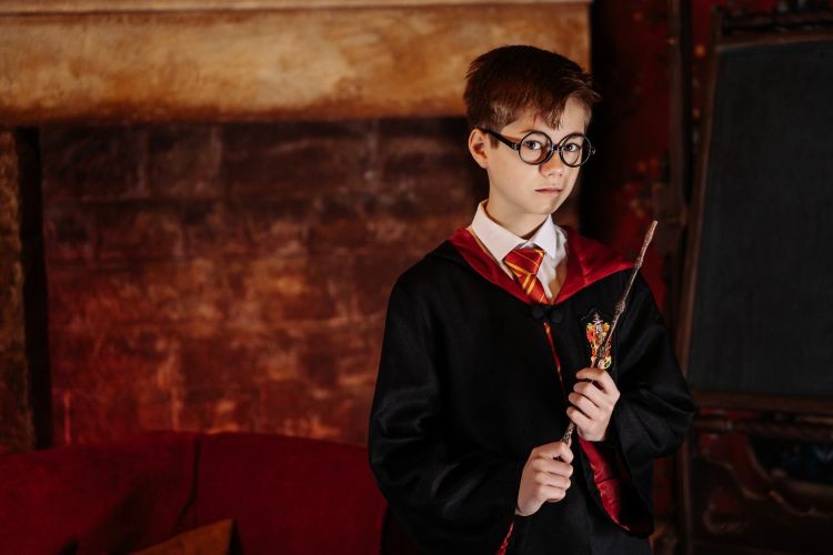 Young boy dressed as harry potter