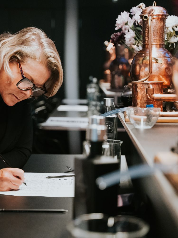 woman on gin making experience in cheltenham