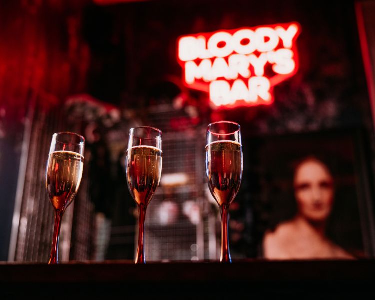 three spooky cocktails on the bar in bloody mary's bar at the house of frankenstein in bath