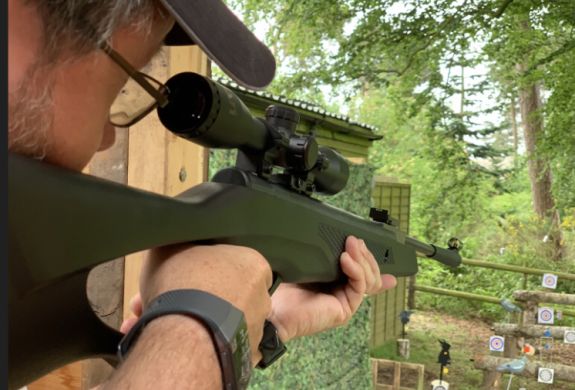 man aiming an air rifle on an air rifle experience day