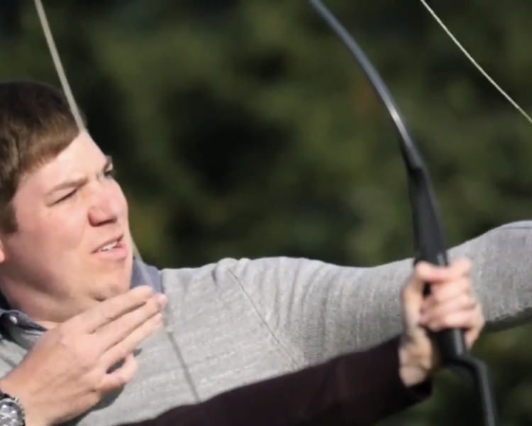 man aiming a bow and arrow playing skybow