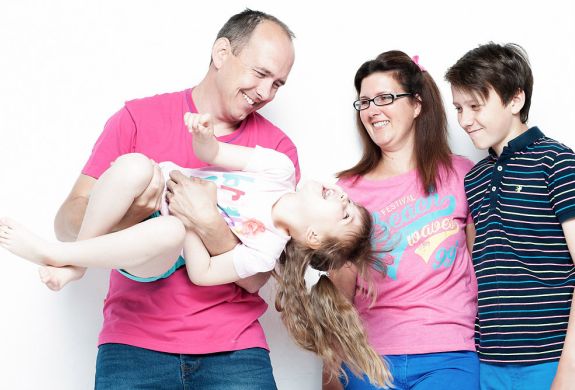 a family of four having a family photoshoot experience