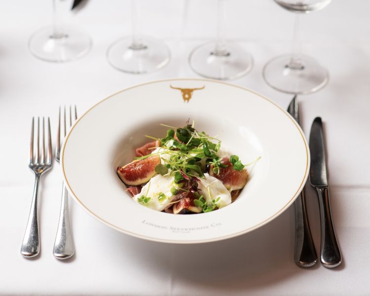 a starter of figs and goats at marco pierre white's london steakhouse company