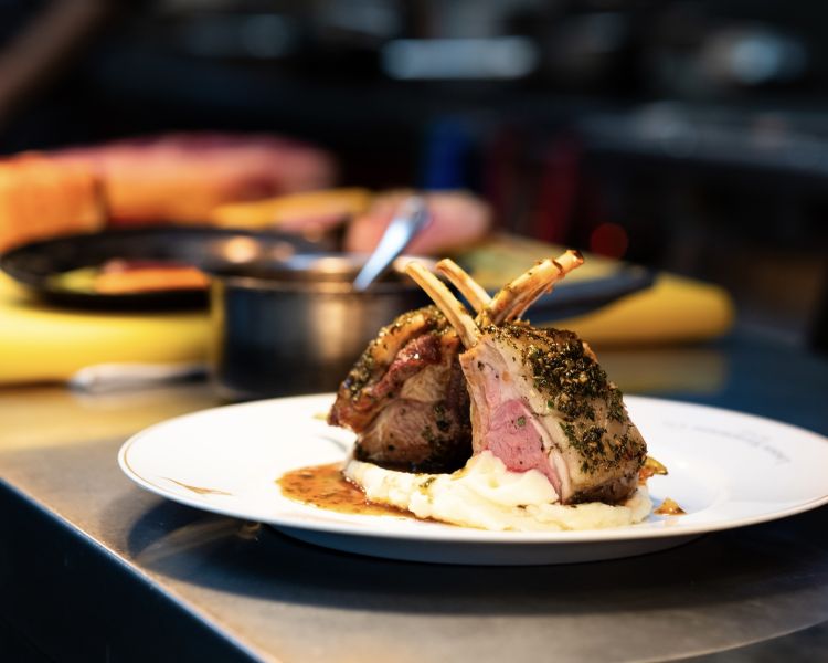 a meal of lamb chops and mashed potato plated up at marco pierre white's london steakhouse company