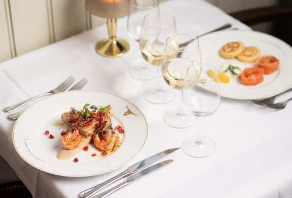 two meals laid out on a table for two at marco pierre white's london steakhouse company