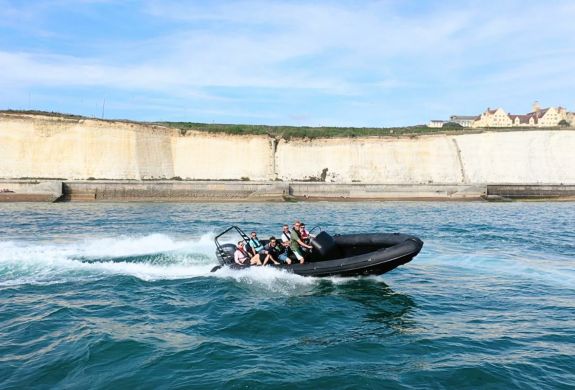 People in a powerboat in the sea