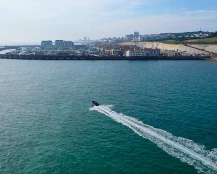 Powerboat in the sea by brighton harbour