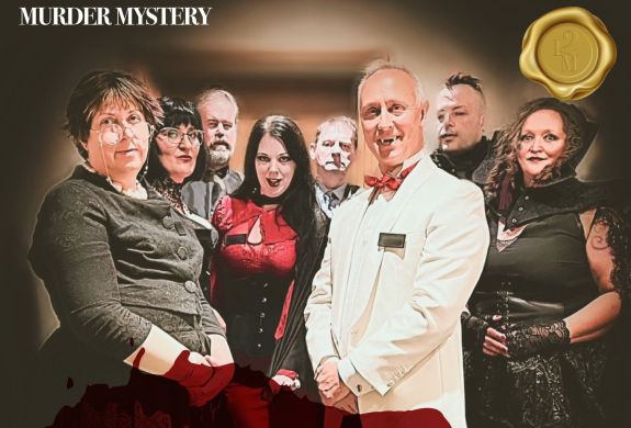 a group of actors dressed up in fancy dress as vampires for a murder mystery dinner experience