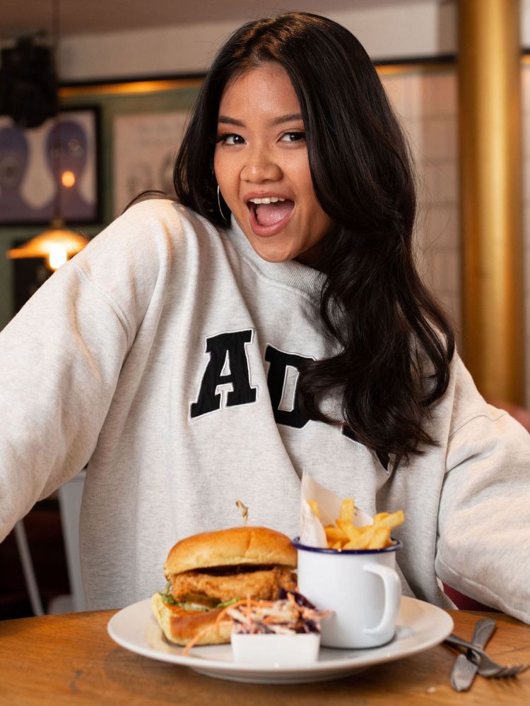 a guest posing with her food