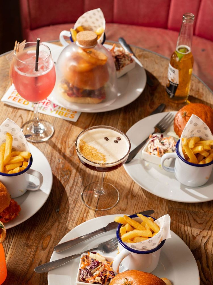 cocktails and burgers on a table