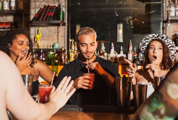 a bartender testing drinks