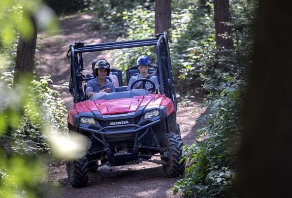 A young driver and instructor on the utility terrain vehicle experience 2