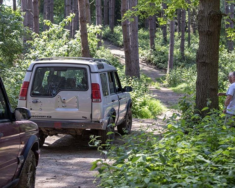 a landrover on a woodland course on an off road driving experience
