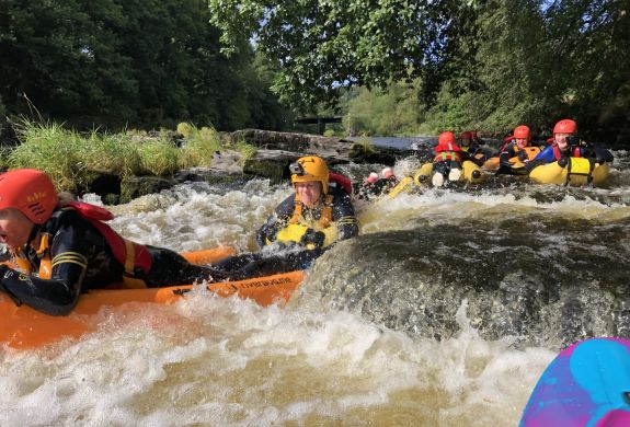 a group on a river bug experience on a river in wales