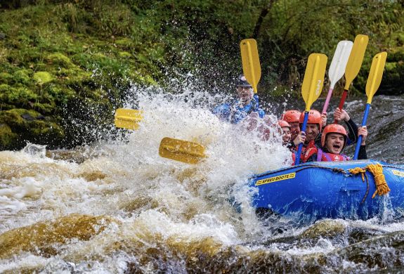 a group on a private whitewater rafting experience in wales