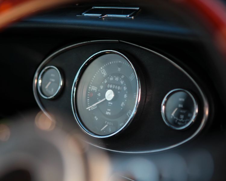 a close up of the dashboard of a vintage mini cooper