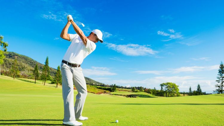 A man playing golf on a golf course