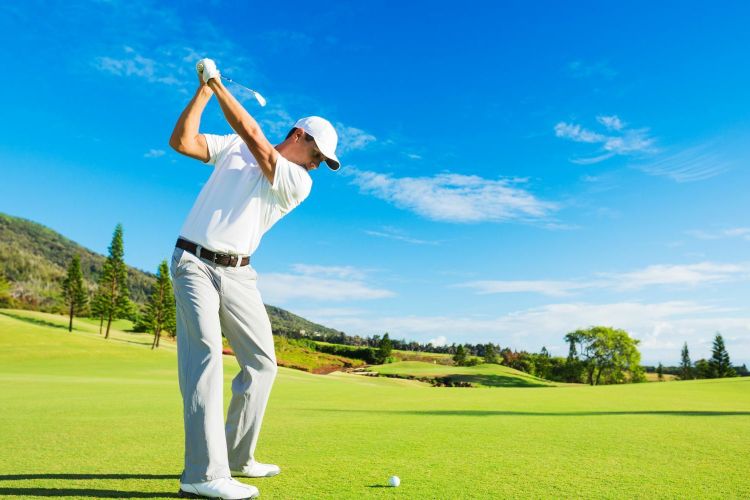 A man playing golf on a golf course