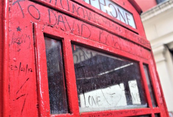 a graffitied phone box seen on the david bowie tour in london