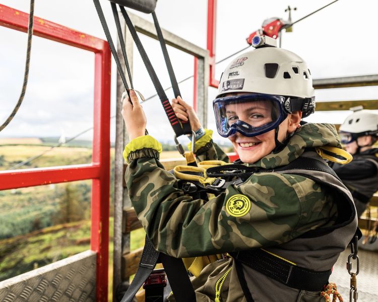young girl ready to go down the zip lines at zip world phoenix