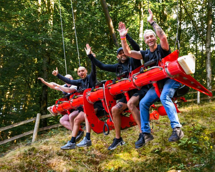 people on the zip world skyride in wales