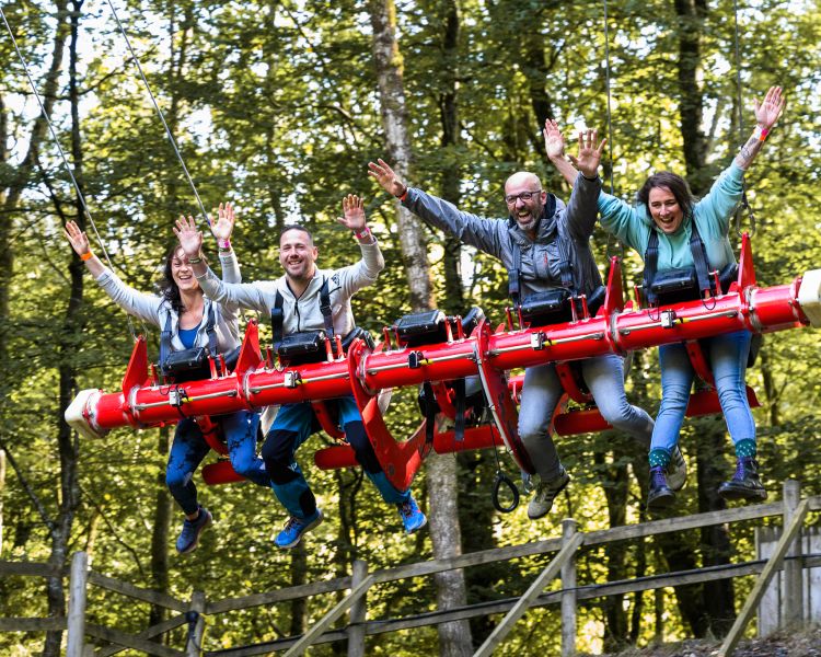people on the zip world skyride in wales