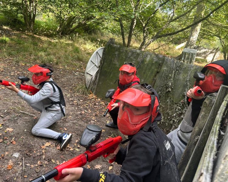 Group playing paintball