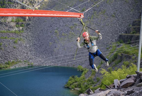 man on the zip world aero explorer overlooking the quarry and lake