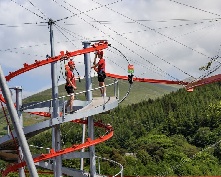 two people on the zip world aero explorer in north wales