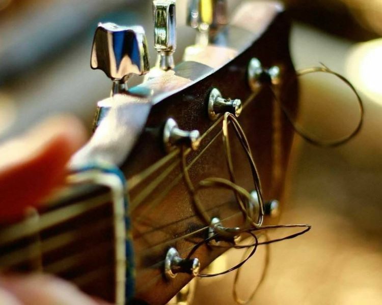 close up of the headstock of a guitar