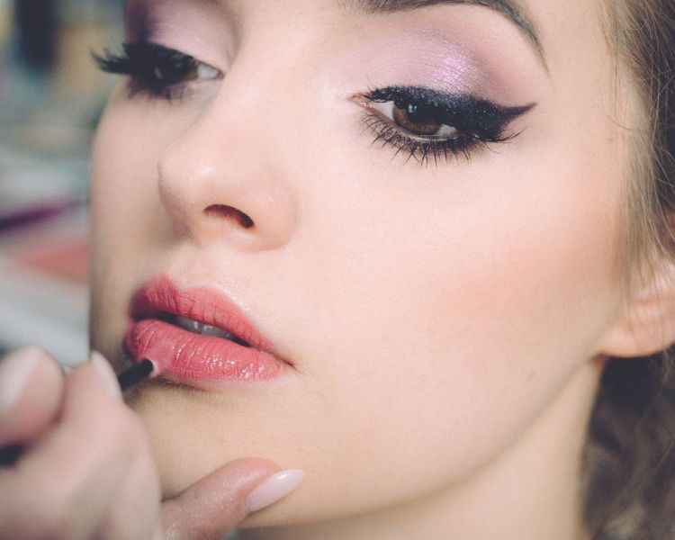 Woman having makeup applied on a makeup tutorial experience 3