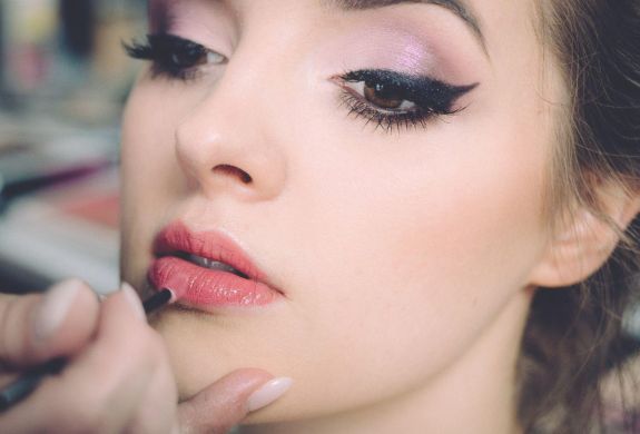 Woman having makeup applied on a makeup tutorial experience 3