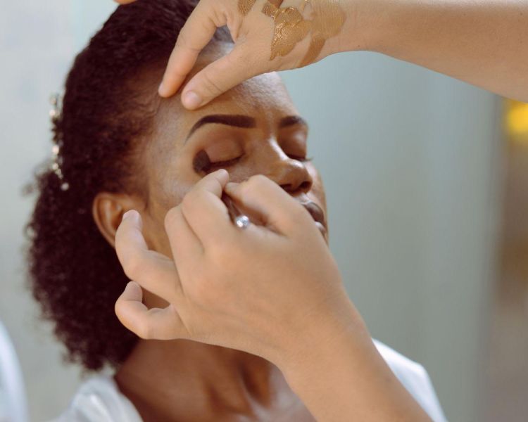 Woman having makeup applied on a makeup tutorial experience